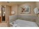 Elegant bathroom with a soaking tub, stylish tile work, and modern fixtures at 211 E Flamingo Rd # 615, Las Vegas, NV 89169