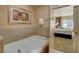 Luxurious bathroom featuring a soaking tub with tile accents and a bedroom view at 211 E Flamingo Rd # 615, Las Vegas, NV 89169