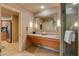 Well-appointed bathroom featuring a double vanity, a walk-in shower, and sleek design elements at 211 E Flamingo Rd # 615, Las Vegas, NV 89169