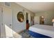 Bright bedroom with an ensuite bathroom, a round mirror, and modern furnishings at 211 E Flamingo Rd # 615, Las Vegas, NV 89169