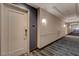 Well-maintained hallway with modern lighting, a neutral color scheme, and carpeted floors at 211 E Flamingo Rd # 615, Las Vegas, NV 89169
