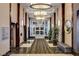 Elegant hotel lobby featuring marble floors, stylish lighting, seating, and elevator access at 211 E Flamingo Rd # 615, Las Vegas, NV 89169