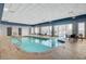 Indoor pool area featuring seating, a soothing atmosphere, and access to an outside view at 211 E Flamingo Rd # 615, Las Vegas, NV 89169