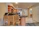 Open concept kitchen has stainless steel appliances and a breakfast bar with seating at 211 E Flamingo Rd # 615, Las Vegas, NV 89169