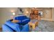 A spacious living room features stylish furniture, including sofa and chairs, plus kitchen view at 211 E Flamingo Rd # 615, Las Vegas, NV 89169