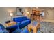 Comfortable living room featuring a blue sofa, contemporary art, and stylish, modern decor at 211 E Flamingo Rd # 615, Las Vegas, NV 89169