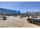 Resort-style pool area with comfortable seating, tables, and sunny views at 211 E Flamingo Rd # 615, Las Vegas, NV 89169