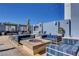 Stylish rooftop lounge with comfortable seating, a fire pit, and panoramic city views at 211 E Flamingo Rd # 615, Las Vegas, NV 89169