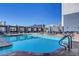 Rooftop pool with lounge chairs and views of the High Roller observation wheel at 211 E Flamingo Rd # 615, Las Vegas, NV 89169