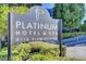 The Platinum Hotel & Spa sign shows lush landscaping and the building's facade at 211 E Flamingo Rd # 615, Las Vegas, NV 89169