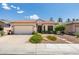 Charming single-story home featuring a xeriscaped front yard and two-car garage at 2111 Tiger Links Dr, Henderson, NV 89012