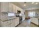 Open kitchen showcasing stainless steel appliances, granite countertops and tile backsplash at 2111 Tiger Links Dr, Henderson, NV 89012
