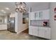 Kitchen nook with granite counters and stainless steel refrigerator at 2111 Tiger Links Dr, Henderson, NV 89012