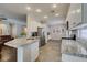 Modern kitchen showcasing granite counters, ample cabinet space, and a stainless steel refrigerator at 2111 Tiger Links Dr, Henderson, NV 89012