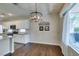Bright eat-in kitchen with stainless appliances, granite counters and warm hardwood flooring at 2111 Tiger Links Dr, Henderson, NV 89012