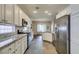 Spacious kitchen with modern stainless steel appliances and stylish granite countertops at 2111 Tiger Links Dr, Henderson, NV 89012