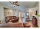 Open-concept living area with hardwood floors, neutral colors and plenty of natural light at 2111 Tiger Links Dr, Henderson, NV 89012