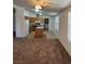 Spacious living room featuring plush carpeting, natural light, and an open layout at 237 Piute Ln, Henderson, NV 89015