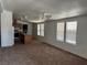 Open-concept living space boasting neutral walls, abundant windows, and a ceiling fan at 237 Piute Ln, Henderson, NV 89015