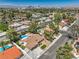 Stunning aerial perspective of the property highlighting the backyard pool, lush landscaping, and overall neighborhood layout at 2504 La Solana Way, Las Vegas, NV 89102