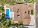 An aerial view of a landscaped home with a sparkling pool and a well-maintained yard, roof, and surroundings at 2504 La Solana Way, Las Vegas, NV 89102