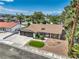 Charming single-story home boasts a well-manicured front yard with lush landscaping and a two-car garage at 2504 La Solana Way, Las Vegas, NV 89102