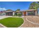 Lovely single-story home featuring a meticulously landscaped front yard, decorative rock, and a charming front door at 2504 La Solana Way, Las Vegas, NV 89102