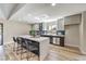 Bright kitchen with a large center island, sleek countertops, stainless steel appliances, and hardwood floors at 2504 La Solana Way, Las Vegas, NV 89102