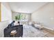 A modern living room with comfortable seating, a large window, and stylish decor at 2504 La Solana Way, Las Vegas, NV 89102