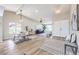 Open floor plan with wood floors and lots of natural light coming in through the windows at 2504 La Solana Way, Las Vegas, NV 89102