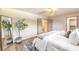 A spacious main bedroom with plush bedding, wood floors, and ample closet space at 2504 La Solana Way, Las Vegas, NV 89102