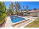 Enjoy the sparkling in-ground pool surrounded by lush landscaping, offering a serene retreat in the backyard at 2504 La Solana Way, Las Vegas, NV 89102
