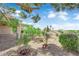 Well-maintained backyard with a patio set, desert landscaping, and perimeter fencing at 2504 Libretto Ave, Henderson, NV 89052