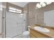 Bright bathroom featuring a glass-enclosed shower and a single sink vanity at 2504 Libretto Ave, Henderson, NV 89052