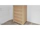 Neutral closet with light color wooden dresser and basic shelving at 2504 Libretto Ave, Henderson, NV 89052