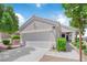 Charming single-story home featuring a two-car garage and well-manicured landscaping at 2504 Libretto Ave, Henderson, NV 89052
