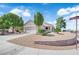 Charming single-story home with desert landscaping, a two-car garage, and a well-maintained lawn at 2504 Libretto Ave, Henderson, NV 89052
