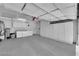 This spacious garage boasts large storage cabinets, a laundry area, and epoxy flooring at 2504 Libretto Ave, Henderson, NV 89052