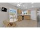 Bright kitchen features warm wood cabinets, stainless steel appliances, and a charming eat-in area at 2504 Libretto Ave, Henderson, NV 89052