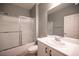 Bathroom with a tub, enclosed shower, vanity, and a large mirror at 2545 Divine Sky Dr, Henderson, NV 89044