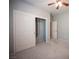 Bedroom featuring neutral walls, ceiling fan, and closet with sliding doors at 2545 Divine Sky Dr, Henderson, NV 89044