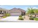 Charming single-story home featuring a well-manicured desert landscape and a two car garage at 2545 Divine Sky Dr, Henderson, NV 89044