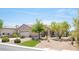 Single-story home featuring a well-manicured desert landscape and a two car garage at 2545 Divine Sky Dr, Henderson, NV 89044