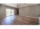 Spacious living room featuring wood-style flooring and sliding glass doors to the outside at 2545 Divine Sky Dr, Henderson, NV 89044
