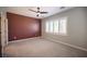 Main bedroom with a contemporary ceiling fan, neutral carpet, and stylish window shutters at 2545 Divine Sky Dr, Henderson, NV 89044