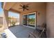 Covered patio featuring ceiling fan, table, chairs, and backyard views at 2545 Divine Sky Dr, Henderson, NV 89044