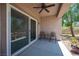 Covered patio featuring ceiling fan, table, chairs, and backyard views at 2545 Divine Sky Dr, Henderson, NV 89044