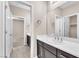 Bathroom featuring a white countertop with dark cabinets and a large mirror at 261 Via Morelli, Henderson, NV 89011