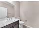 Modern half bathroom with a single sink vanity and neutral wall color at 261 Via Morelli, Henderson, NV 89011