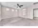Primary bedroom featuring carpet flooring and an ensuite bathroom entrance at 261 Via Morelli, Henderson, NV 89011